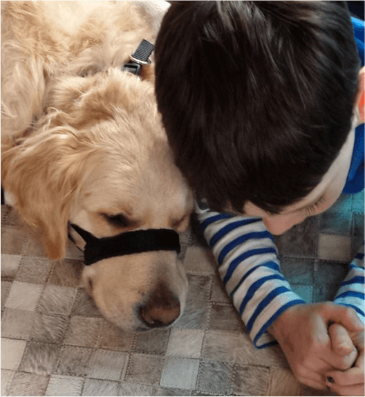 Uno and boy reading